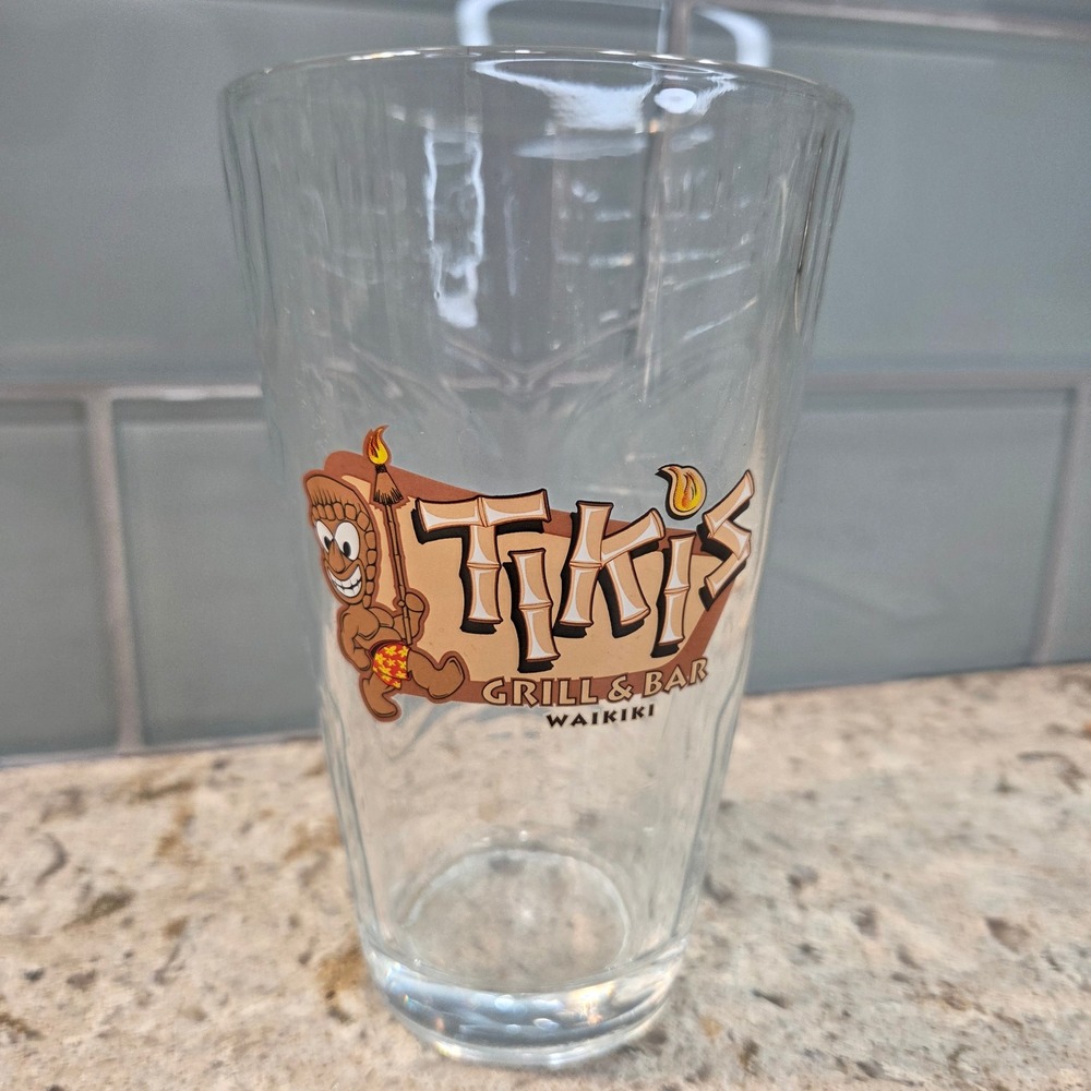 Tikis Grill & Bar Waikiki Hawaii Tiki Face Embossed Clear Glass Souvenir Pint